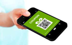 Person holding a mobile coupon