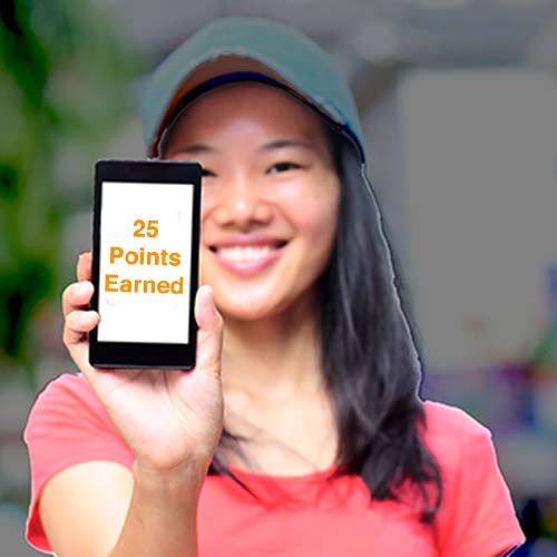 Woman holding mobile phone showing loyalty points earned