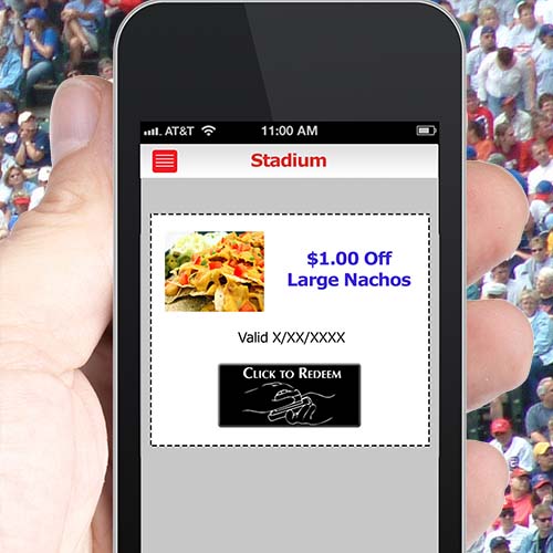 Person at a sports stadium holding mobile coupon.