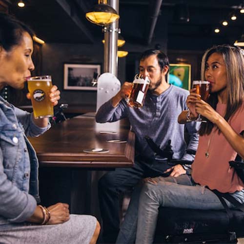 Friends in a bar drinking beer.